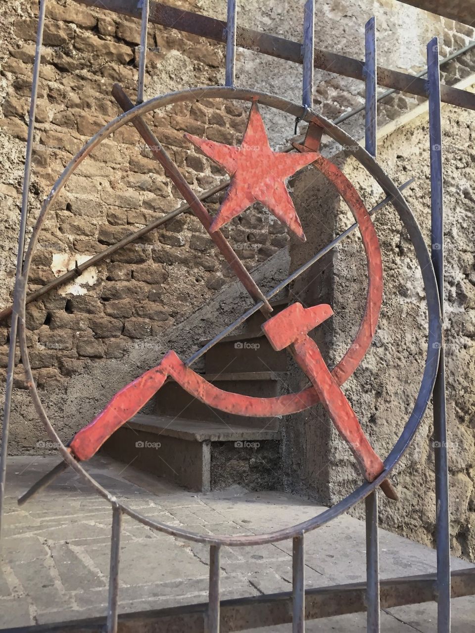 Hammer and sickle on an iron balustrade