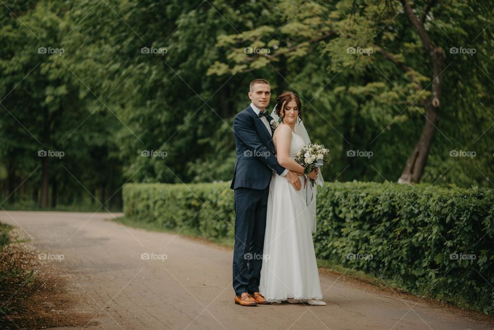 Happy bride and groom in the park