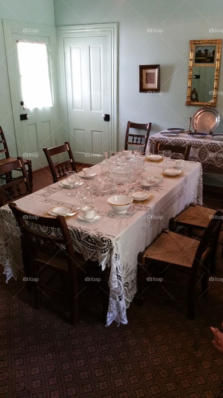 table and chairs with dishes
