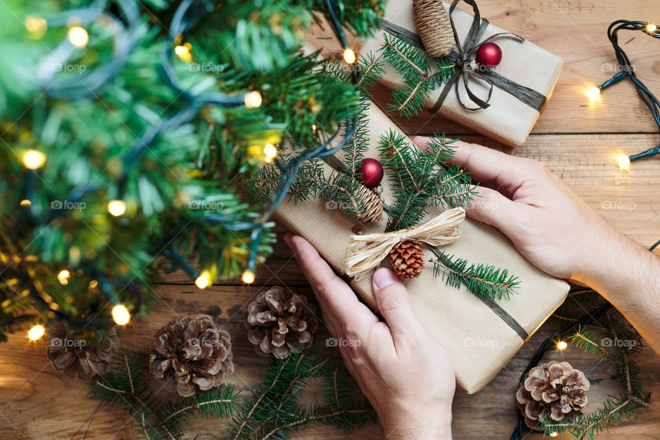 Close-up of hand holding christmas gift