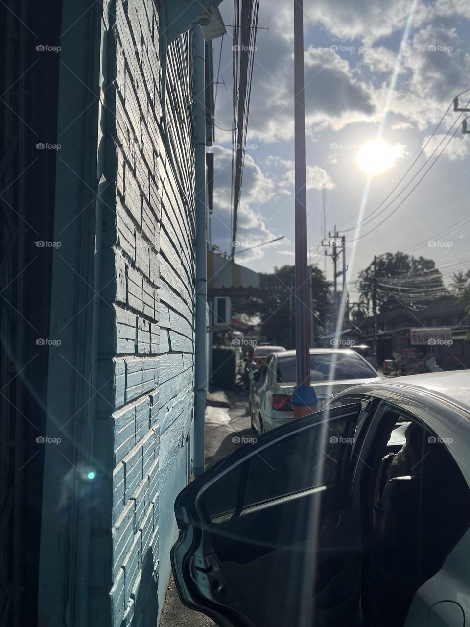 Wall texture beside the road and the sun shines directly 