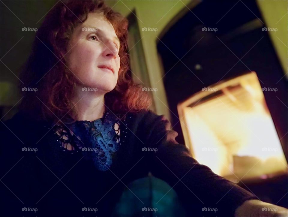 This lovely lady in „Bavaria“, Germany is definitely enjoying her indoor fireplace especially now that it is cold outside and Christmas time is near. 2023. Hypnotic Productions