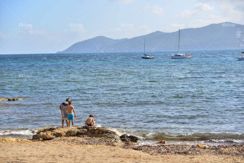 Little boys plaing at the beach