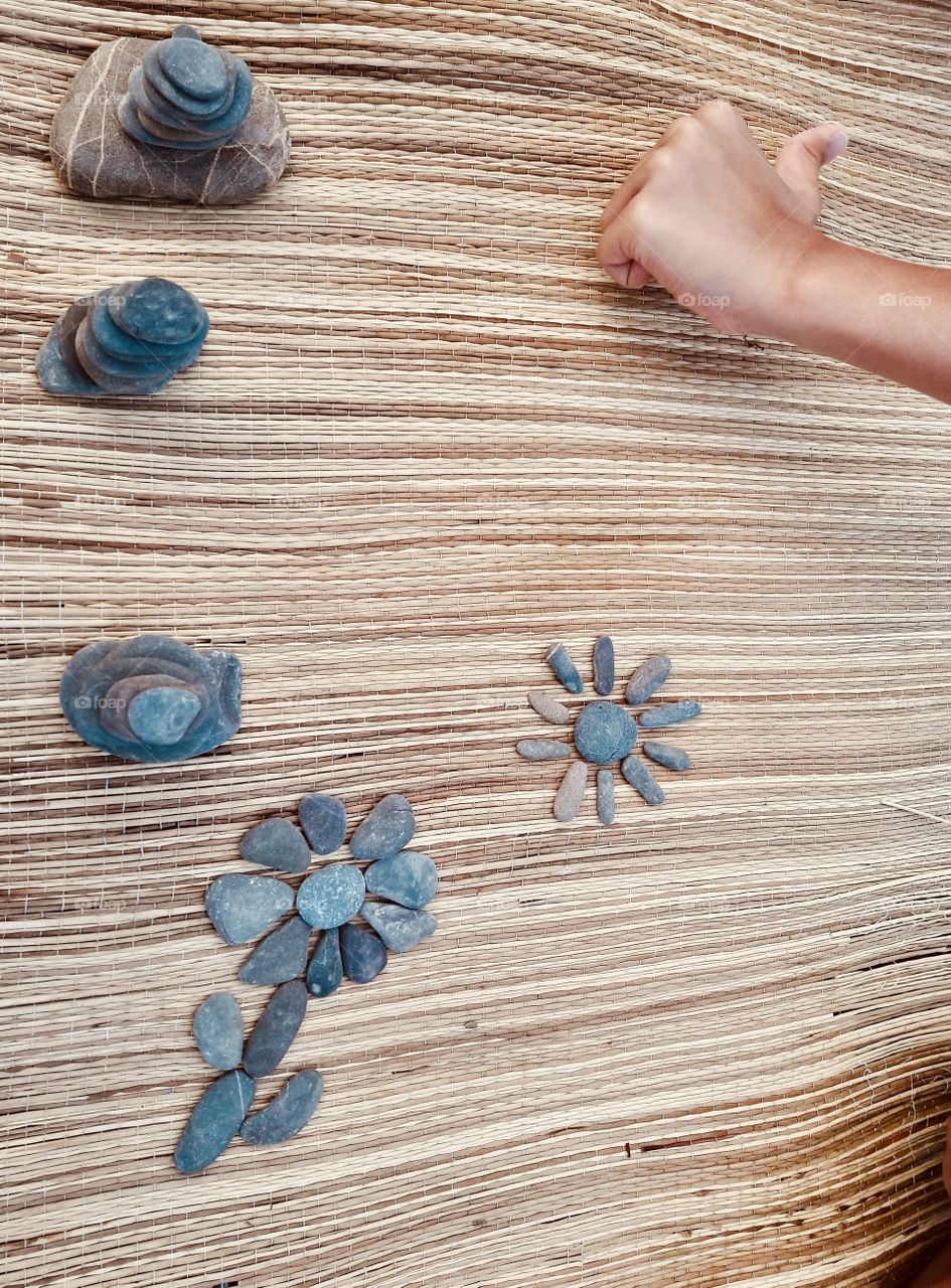 on the beach. we make figures and towers from small pebbles.