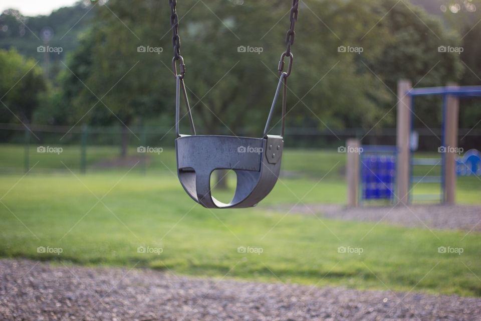 Lonely swing in the summer