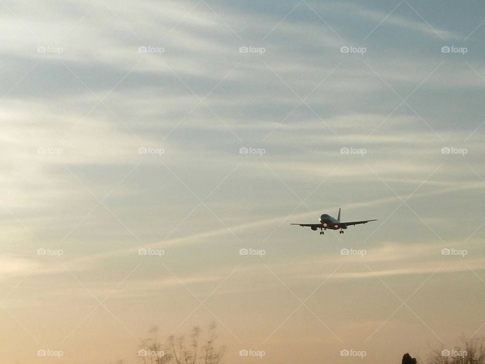 Beautiful airplane flying cross the sky