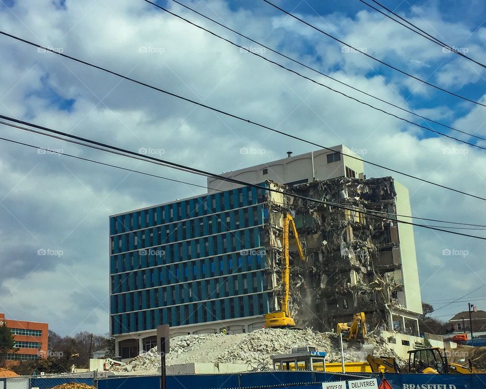 Tearing down an old building to rebuild Atlanta. Gentrification 