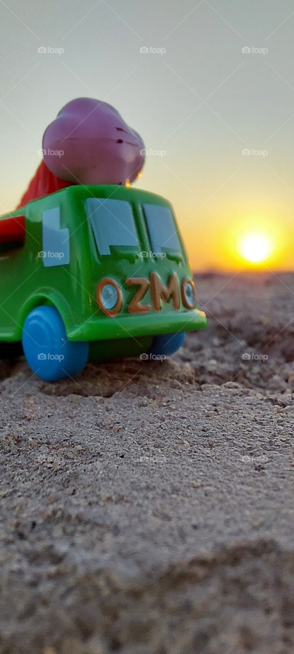 sunset with small car toy