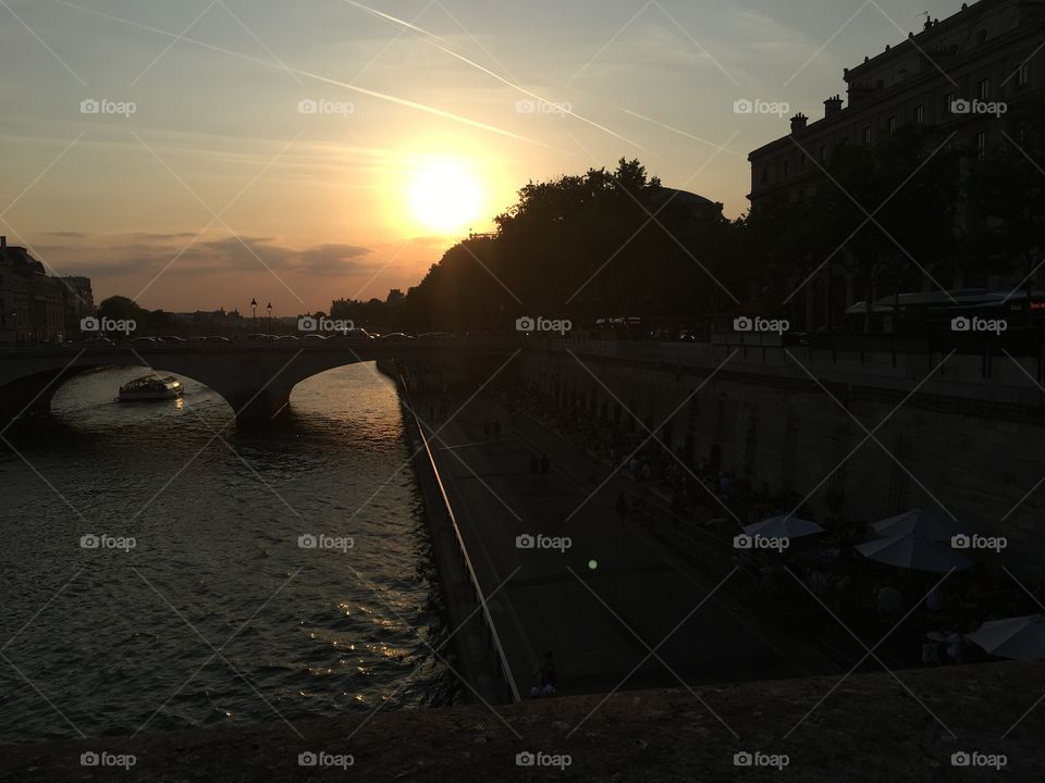 A stunning sunset, taken from a bridge overlooking the Seine River in Paris 