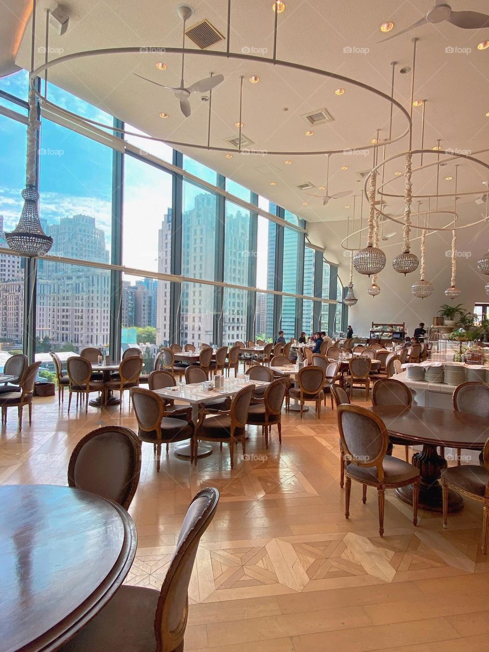 bright dining room with floor to ceiling windows