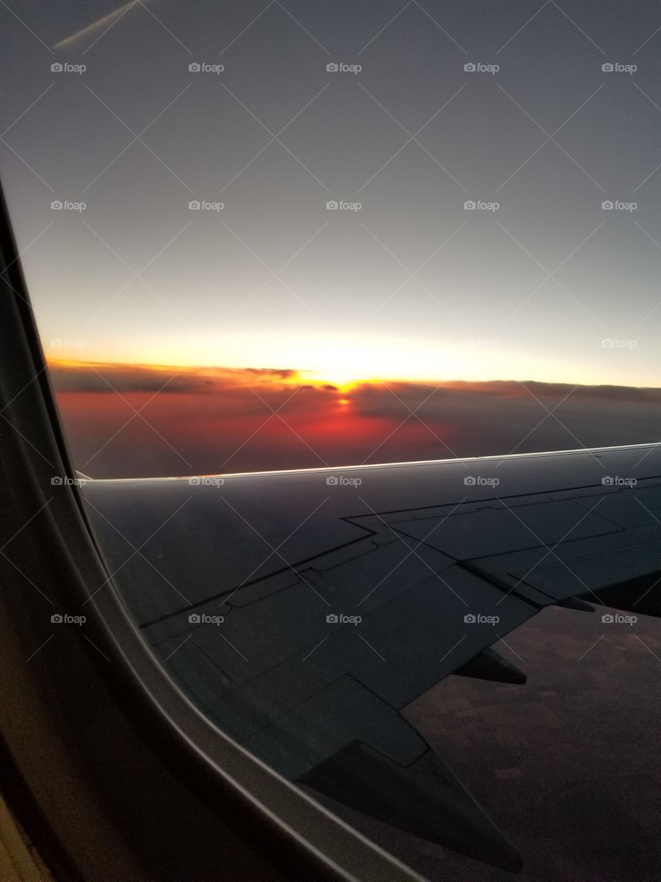Sunset over plane wing 2