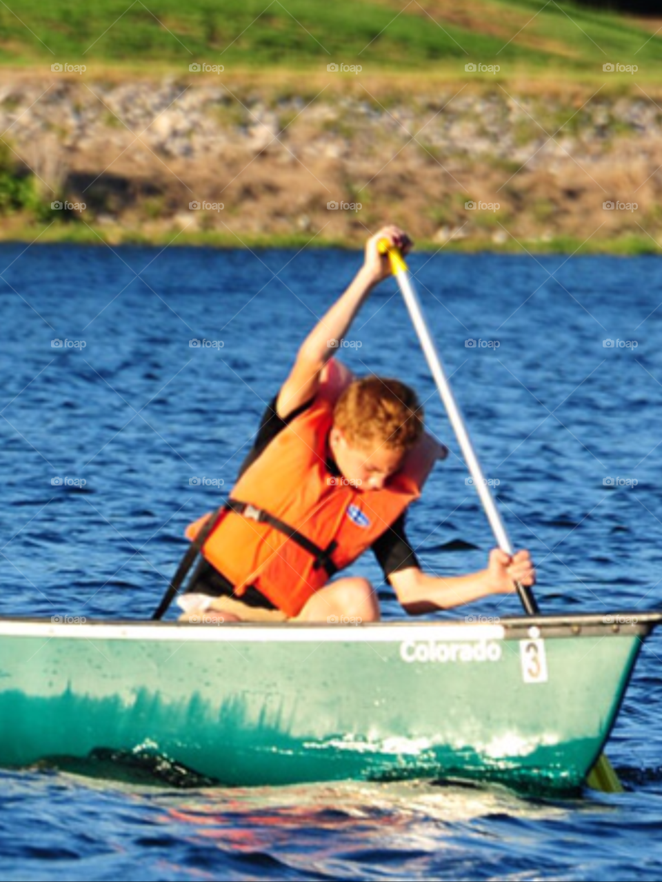 boy canoeing canoe by lightanddrawing
