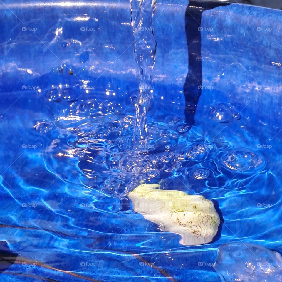 water falling blue pot