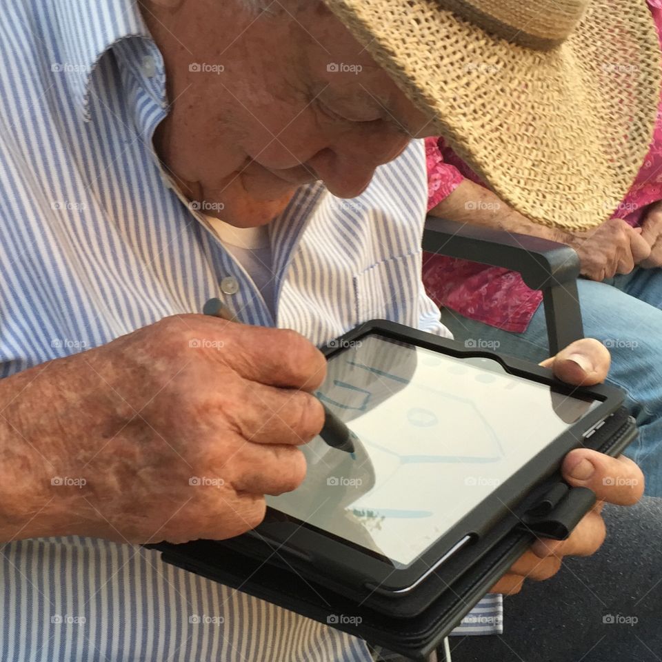 Grandpa using technology. My grandpa is almost blind but he still wants to see all the technology we're using. 