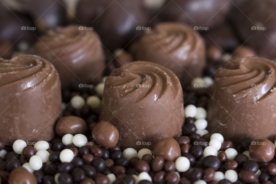 Milk chocolate swirls and dark white small chocolate balls