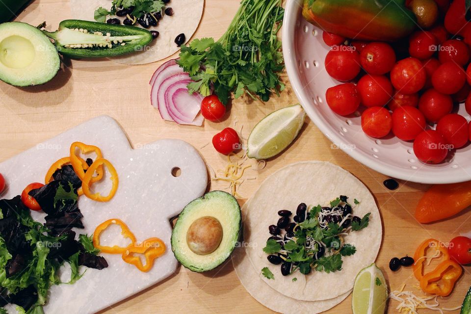 Fiesta inspired meal preparation with fresh produce.