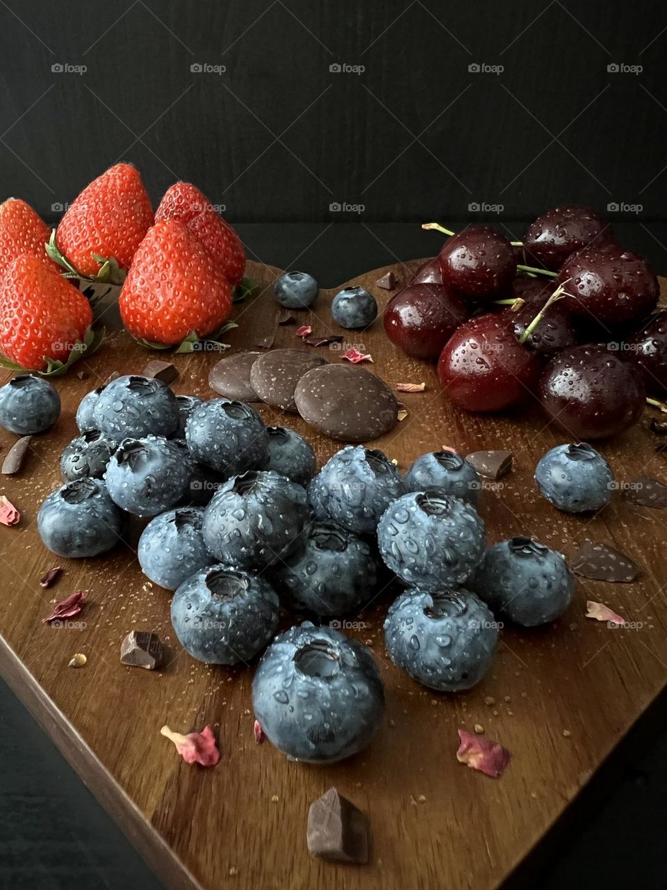 Summer treats, summer snacks, delicious summer berries: strawberry, cherry and blueberry.