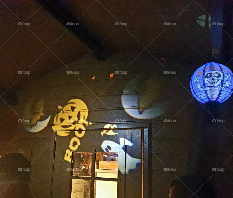 Halloween signs on a barn door.