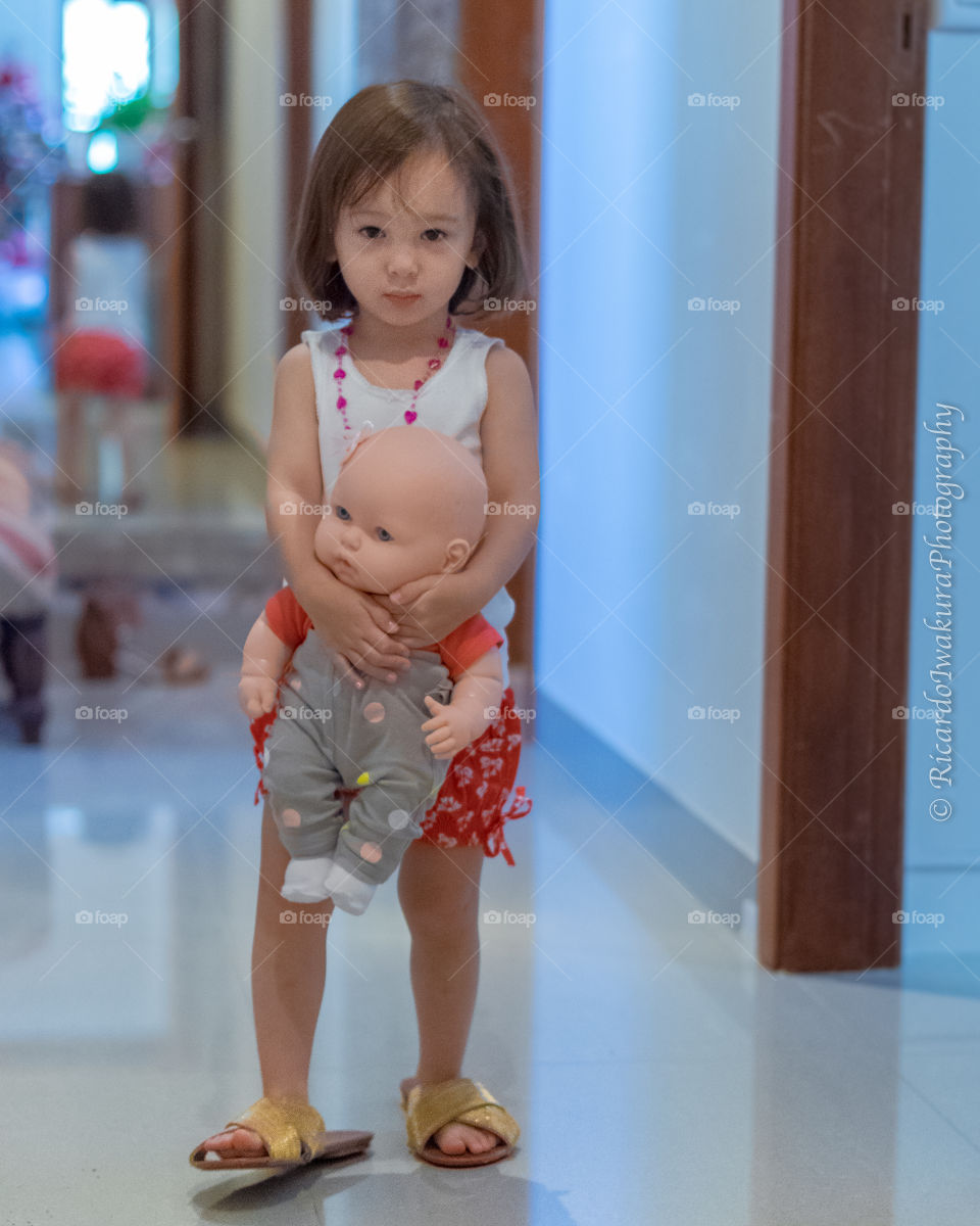 Close-up of girl with toy