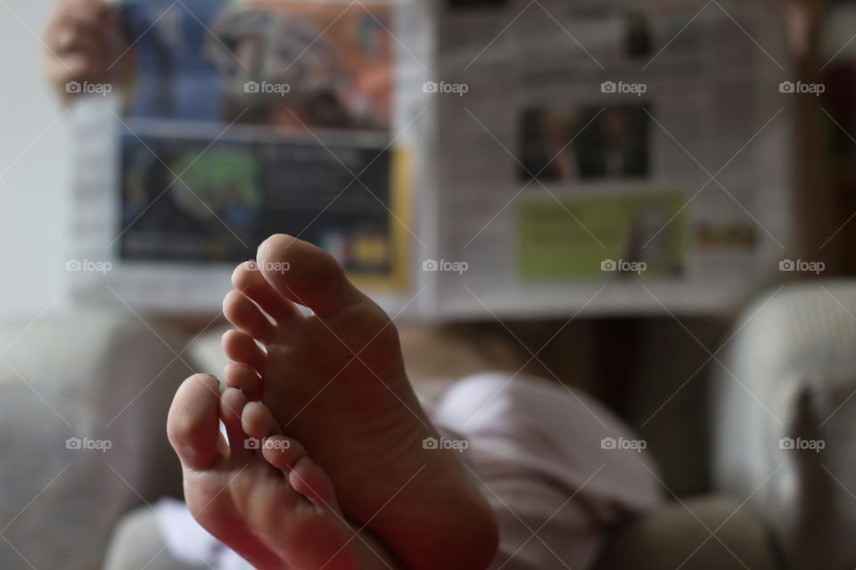 Feet and newspaper