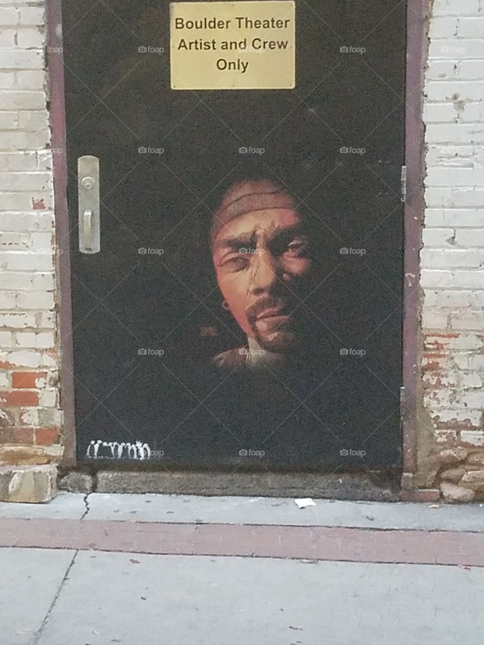 Painted on the back door of the Boulder Theater.