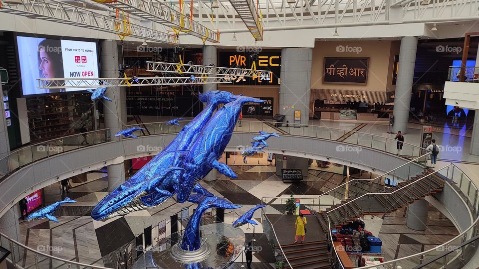 Giant Blue whale Statues in the middle of a Shopping Complex