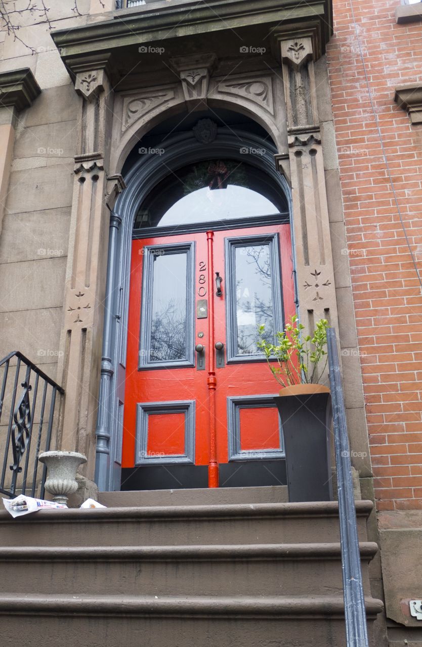 Red door on brick building 