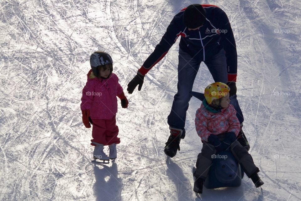 Family on ice rink