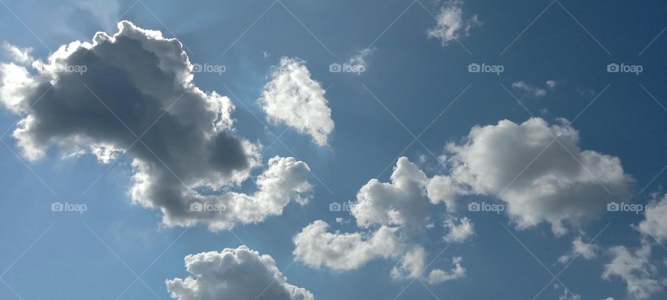 Cloudy sky with hidden Sun