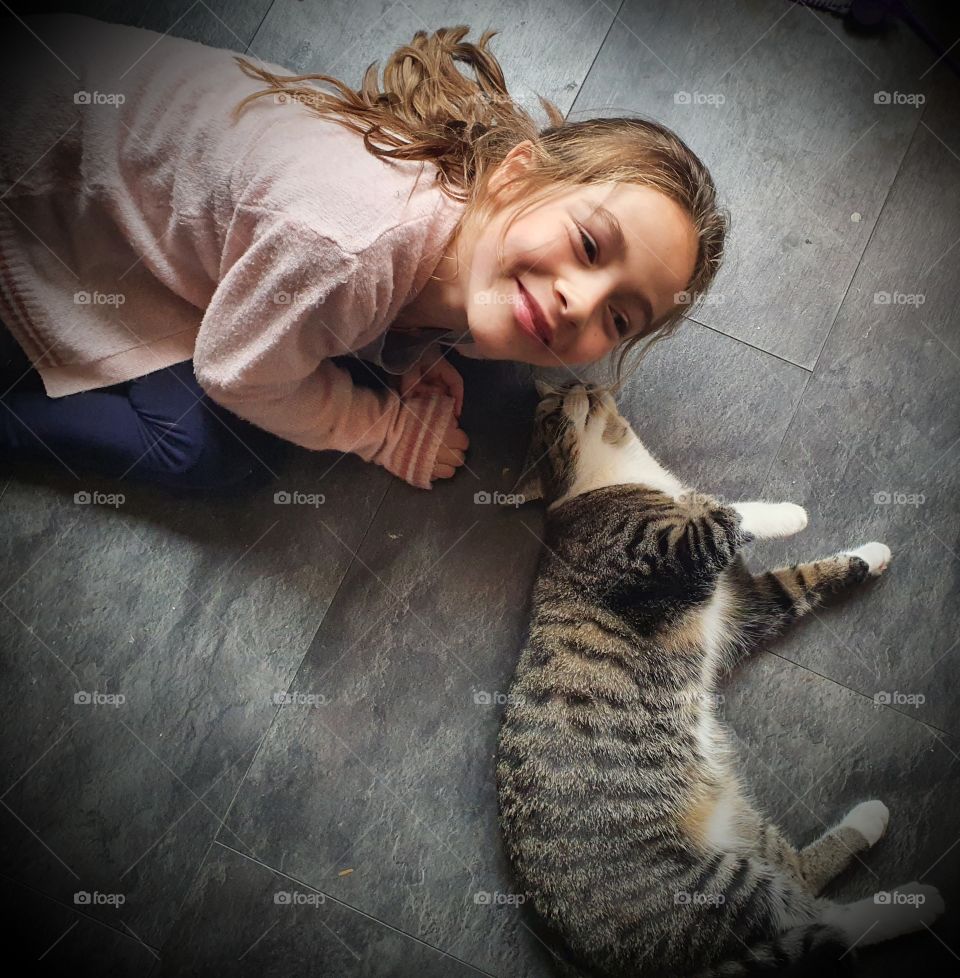 Girl wants to play with tiger the house cat