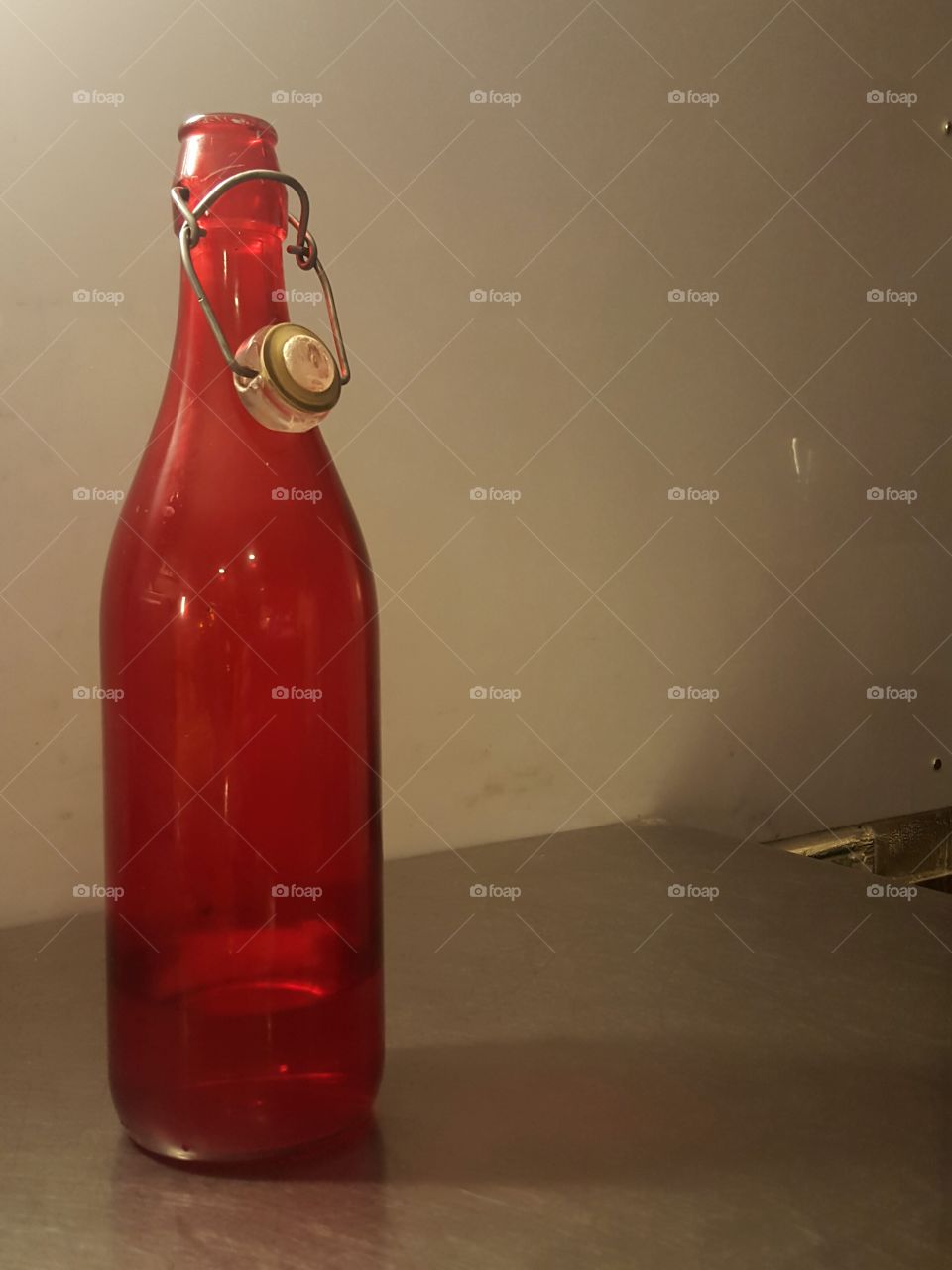 Red glass water bottle