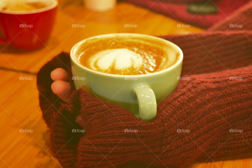 A cup of coffee and a cold day in winter time. This cup and liquid give us the warmly moment in our day :)