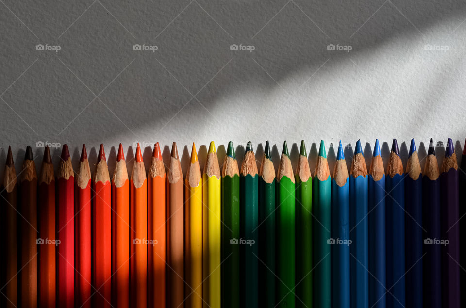 Sunlight and the colorful pencils.