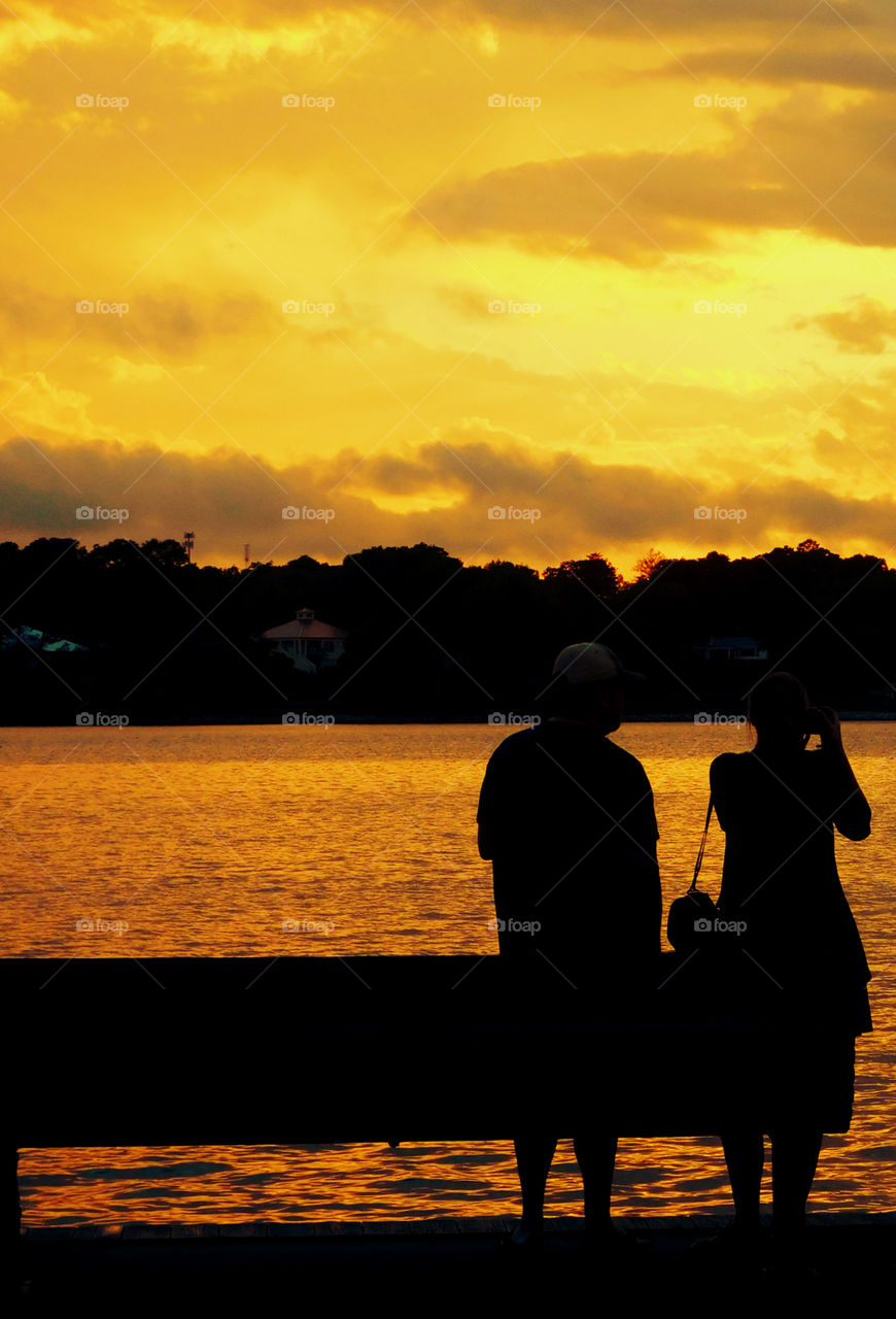 The sky was filled with the most brilliant orange complimented perfectly with hues of gold, yellow, red and crimson. An orange haze had casted over the water, reflecting off every wave.  Finally,the sun disappears along with the shine. I can only wait to see another magical moment of beauty and warmth! I can only wait for another sunset! Enjoy!