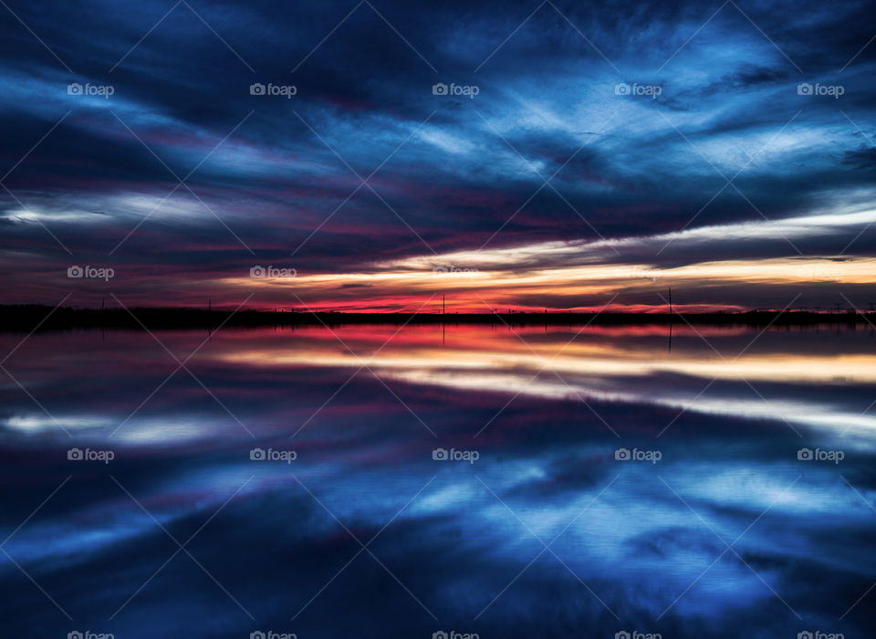Cloudscape reflecting on lake