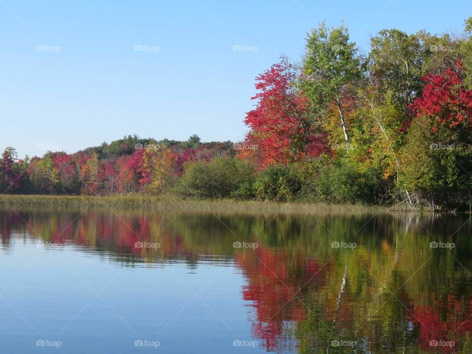 Fall Colors reflecting on calm lake waters