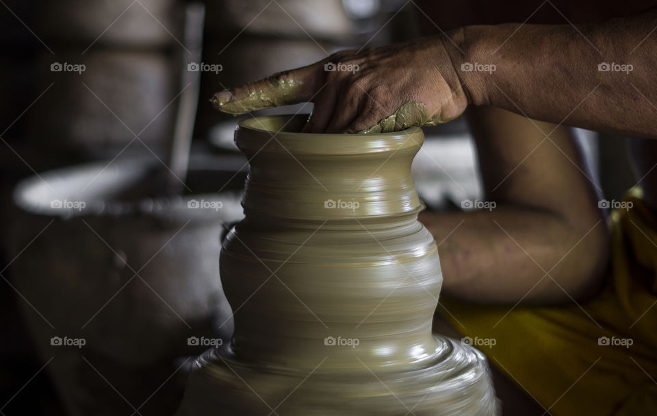 A lump of clay is spun on a turn table and is gently caressed to create these elegantly shaped vases.