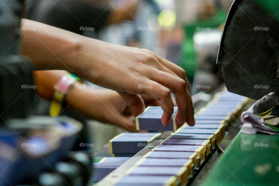 A person arranging boxes