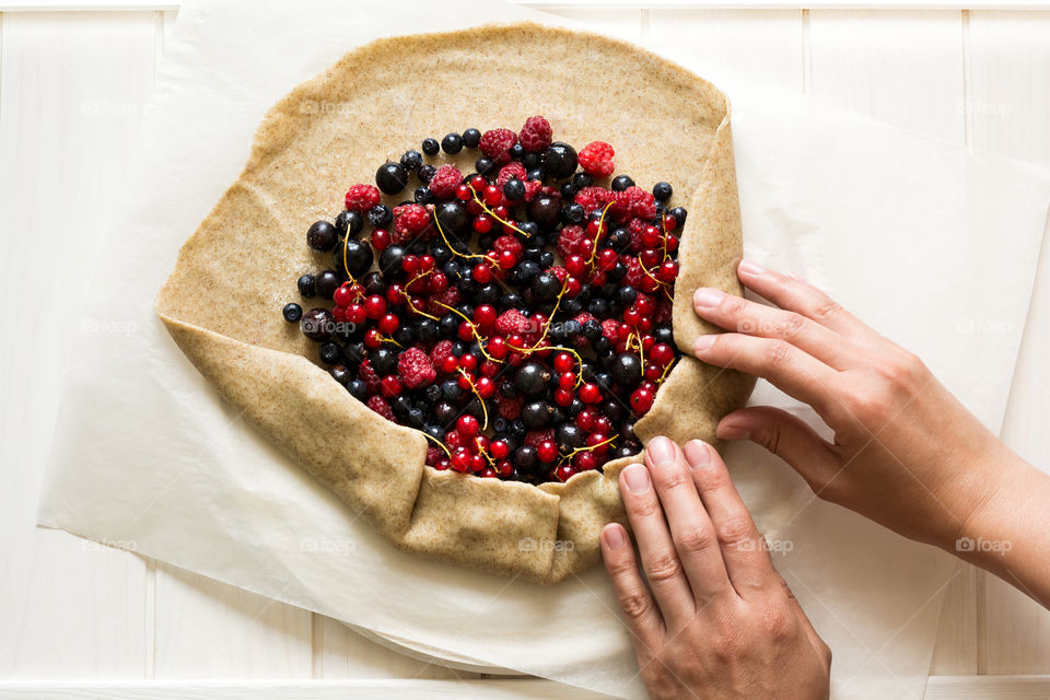 Preparing berry galette