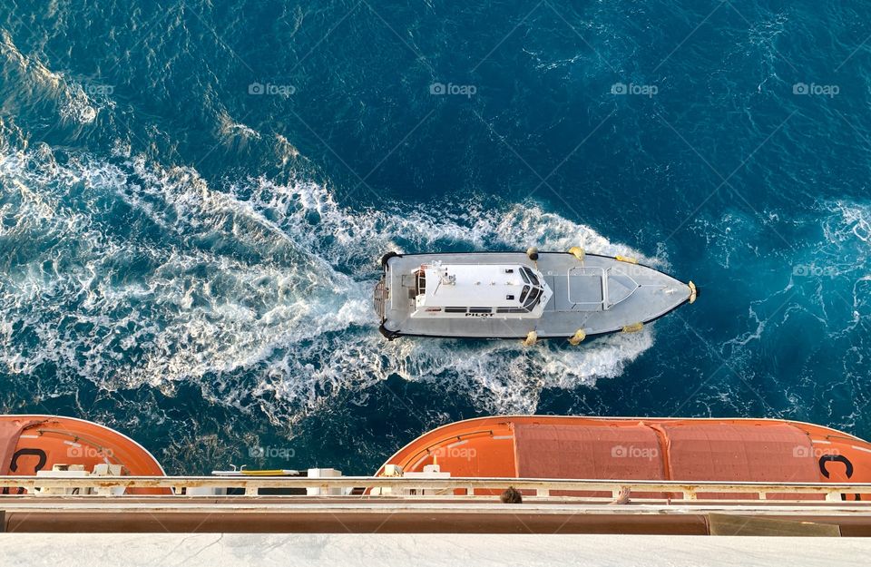 Boat in the ocean view from above looking down