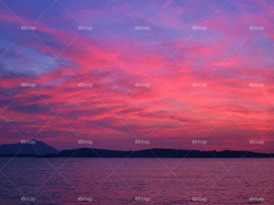 Sea under pink clouds at Bagnoli ( Naples - Italy ).