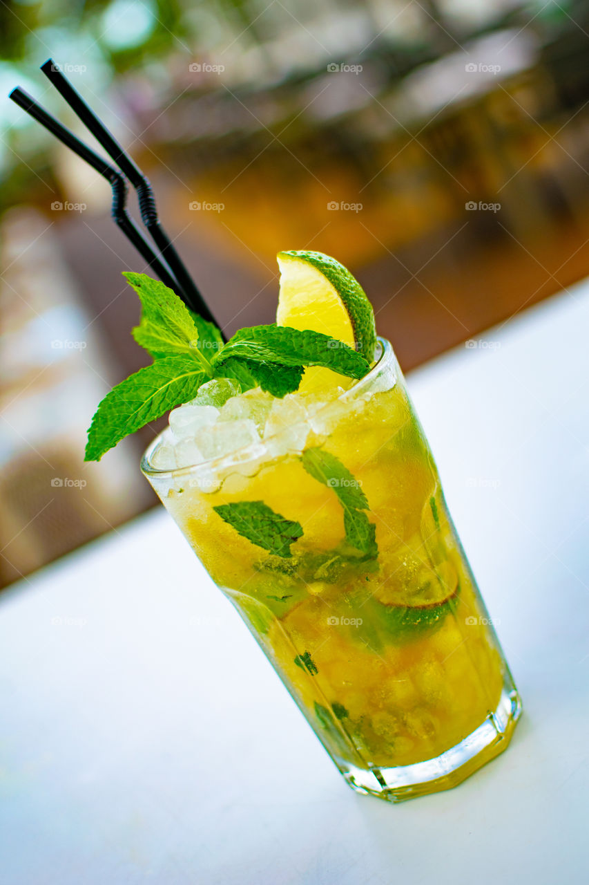 a close up on a chilled mojito cocktail