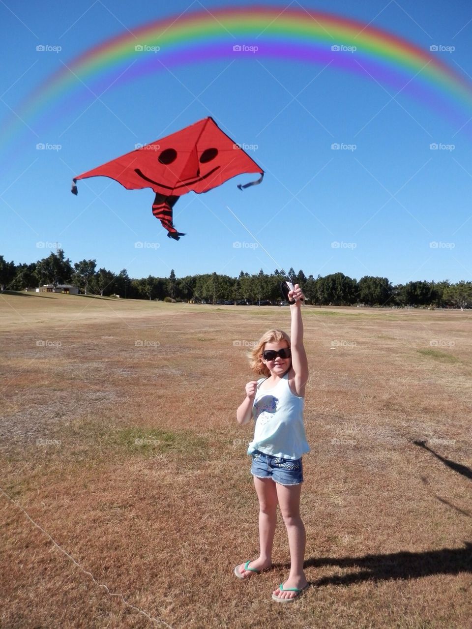 Flying Kite Under Rainbow