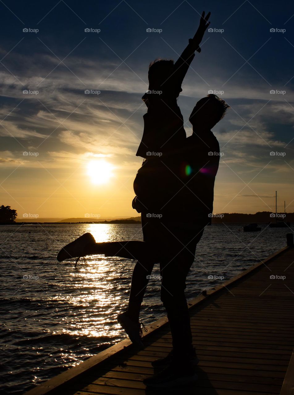 Two love ones dancing into the sunset ,a summer evening.  They are in love