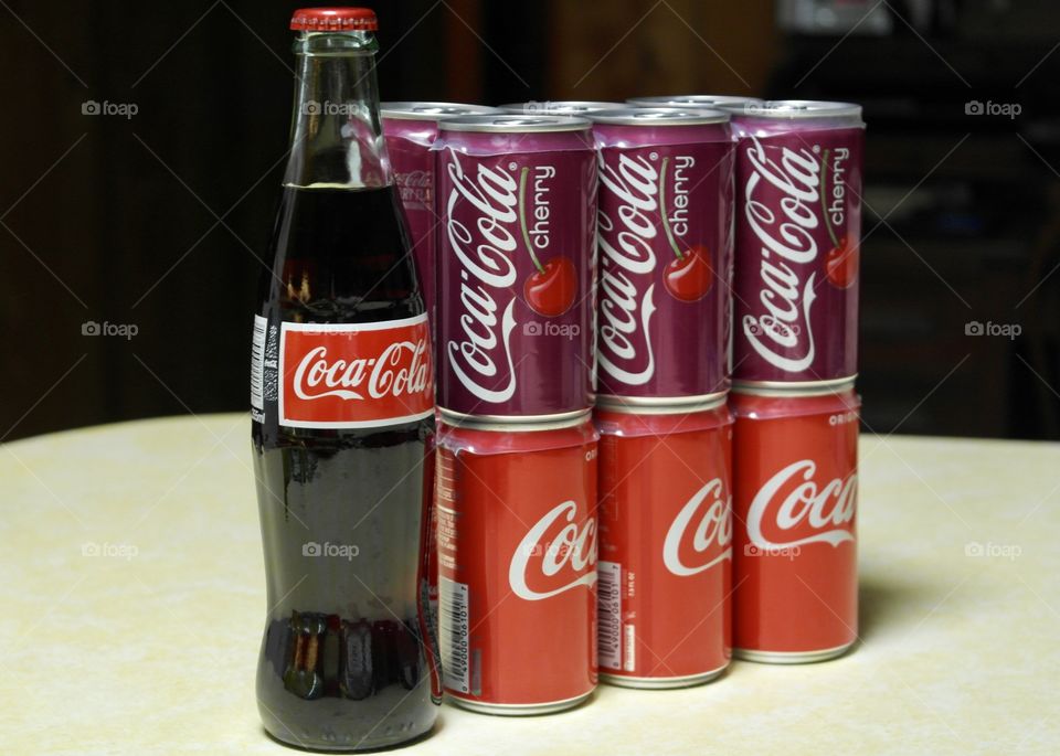 Coca Cola and cherry coke cans and bottle 