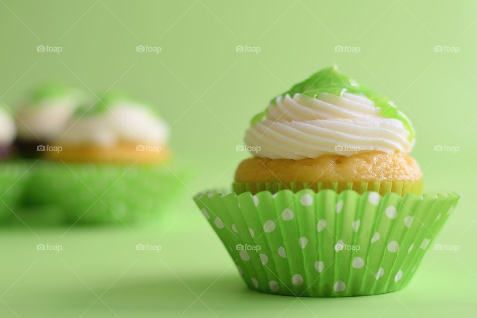 Close-up of cupcake against green background