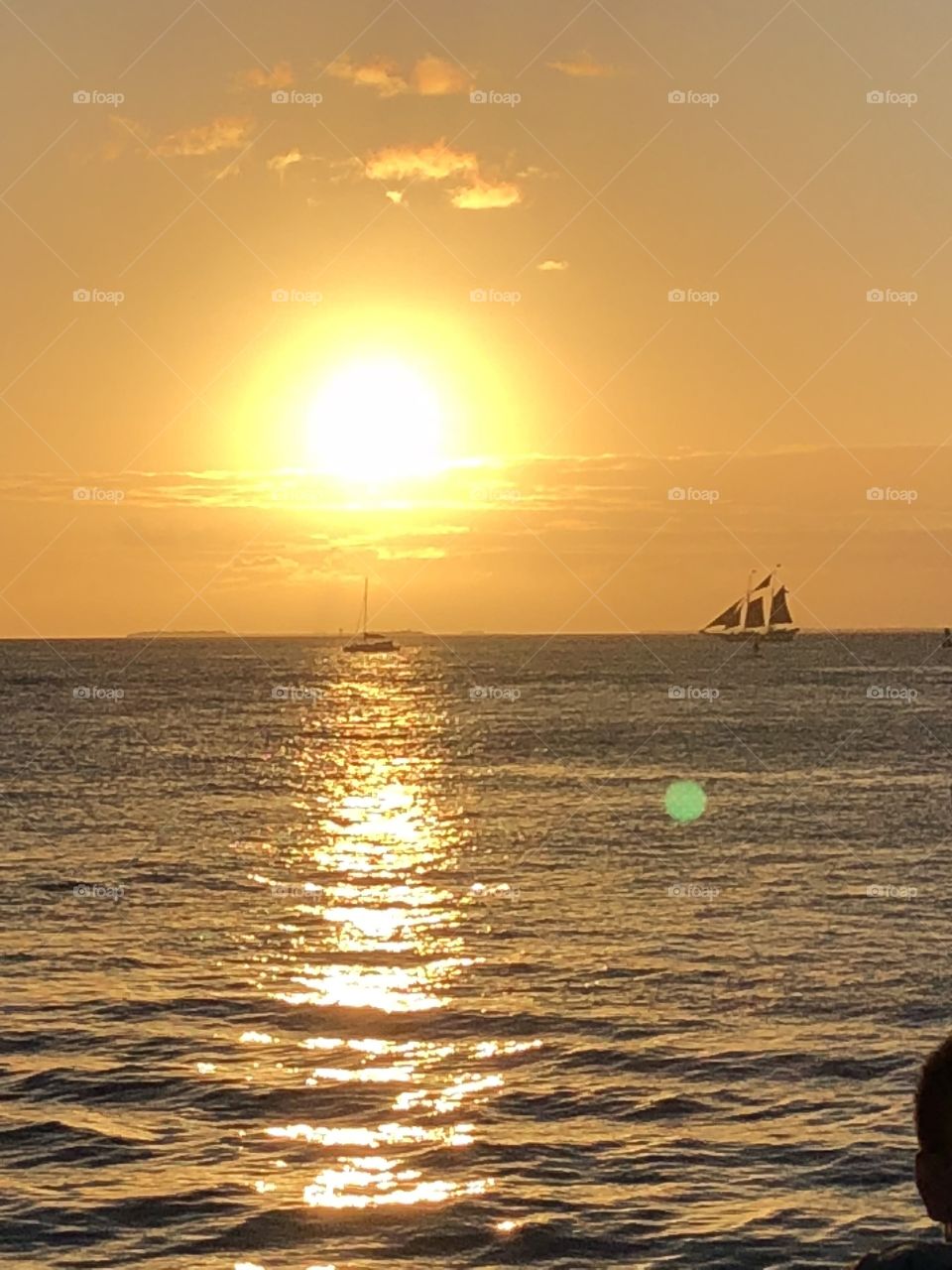 A stunning and vibrant waterfront sunset from Mallory Square in Key West. 