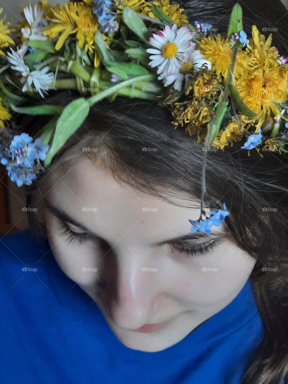 portrait of young girl in spring wreath