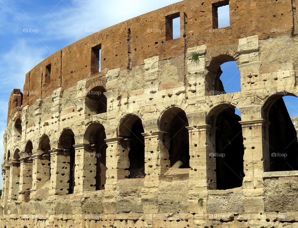view of rome Colosseum under blue sky
