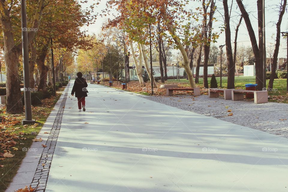 A woman walking in the park